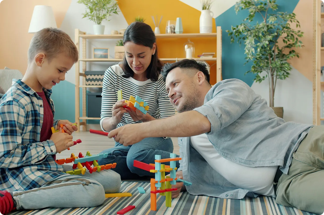 Family playing together in a cozy furnished living space