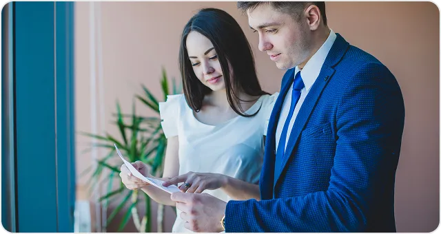 Two colleagues reviewing requirements on a tablet