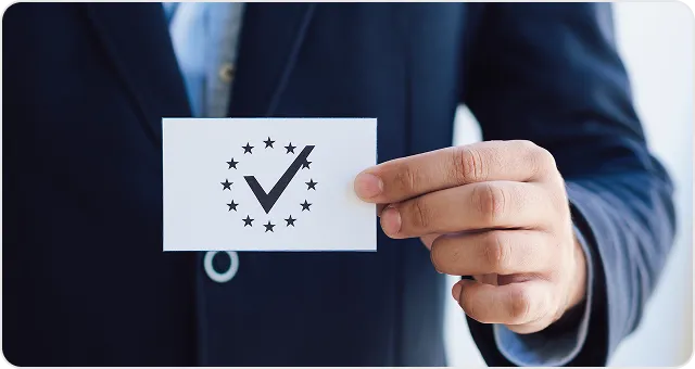 Person holding a document with a checkmark