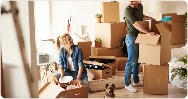 Family unpacking boxes in a new home