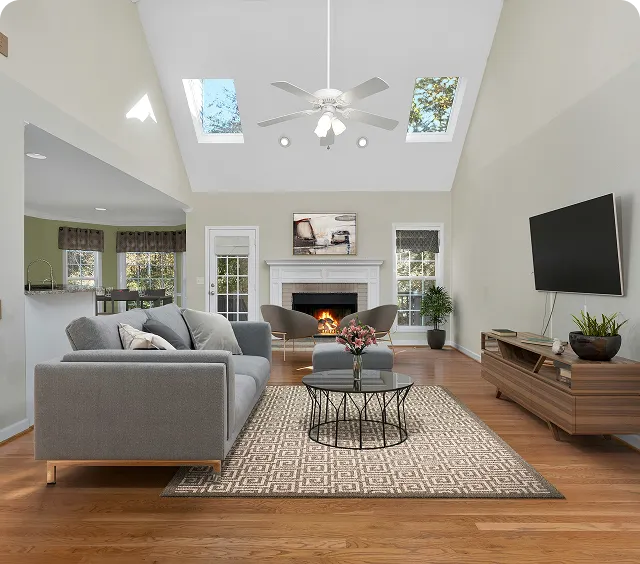 Spacious living room with natural light and modern furnishings
