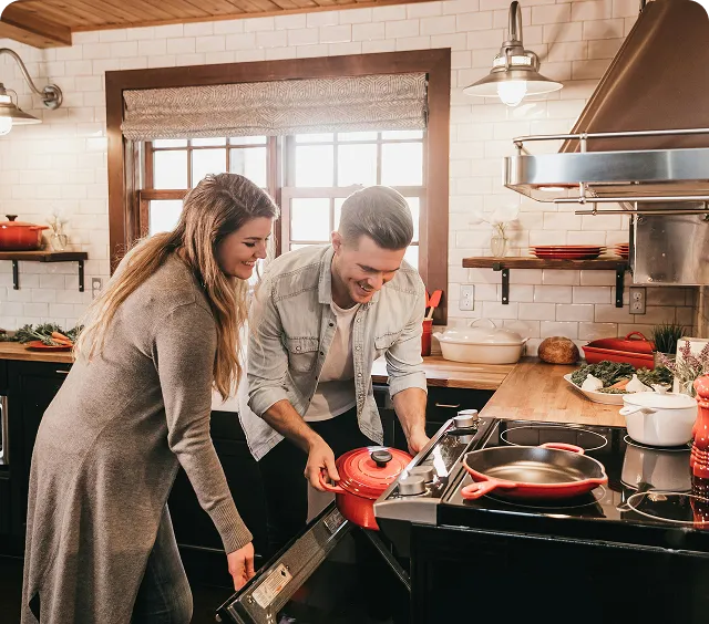 Couple cooking together in a fully equipped kitchen