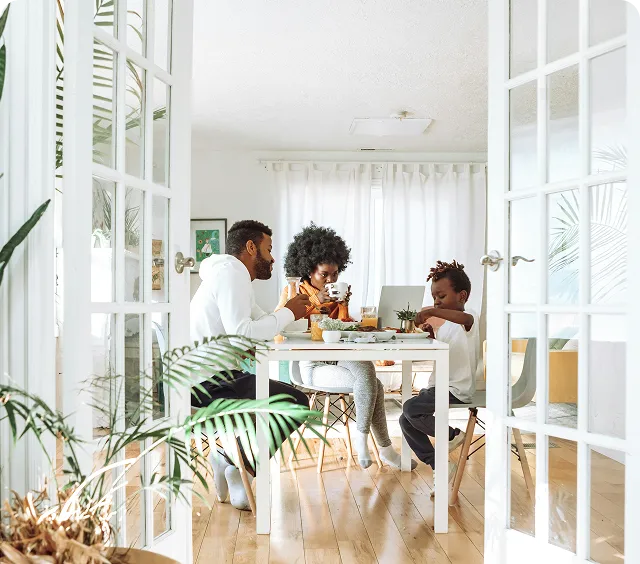 Family enjoying a meal together in a bright dining space